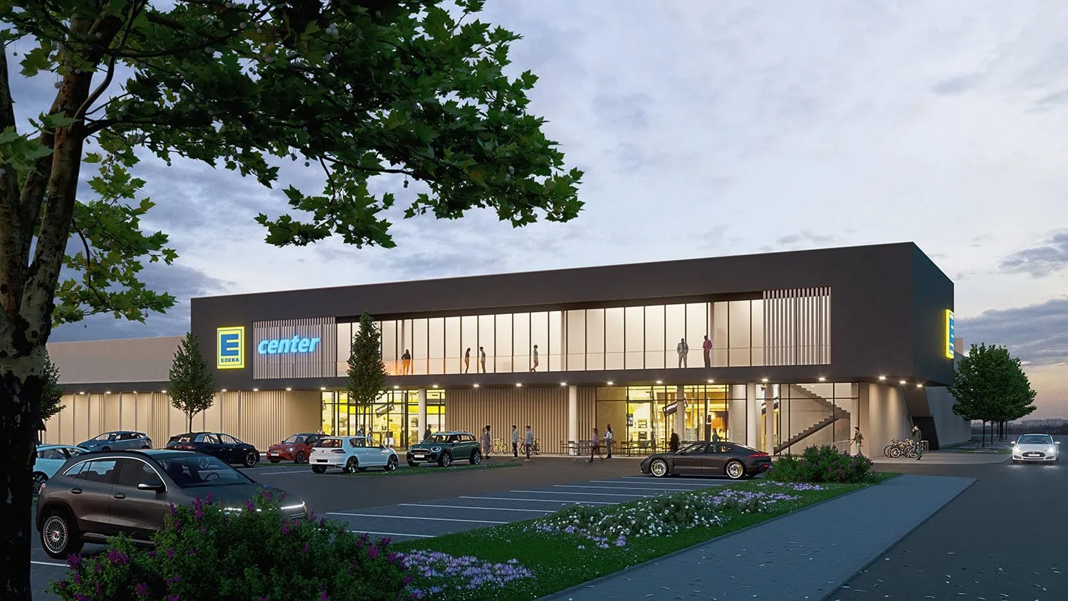 Visualisierung eines Supermarkt-Neubaus mit beleuchteter Fassade in der Abenddämmerung